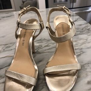 Gold high heel shoes